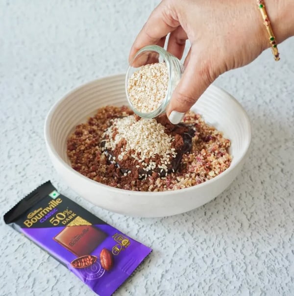Black Chocolate Truffles with Dry Fruits & Almonds - Add roasted white sesame seeds