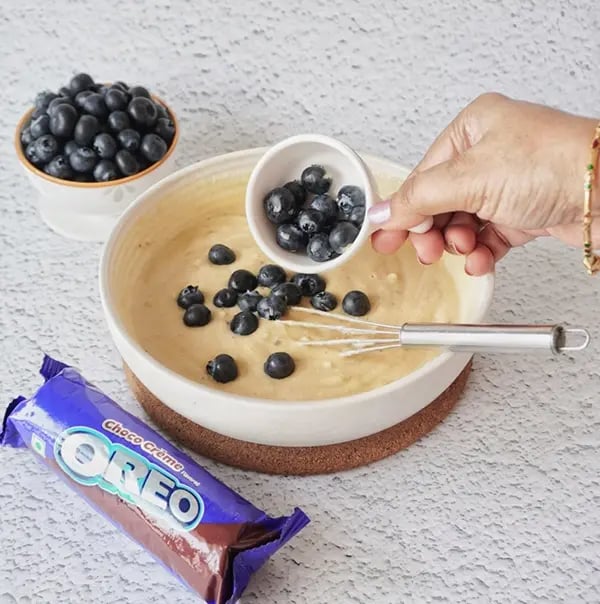 Blueberry Coffee Cake with Oreo Crumble and Almonds-Gently fold the blueberries