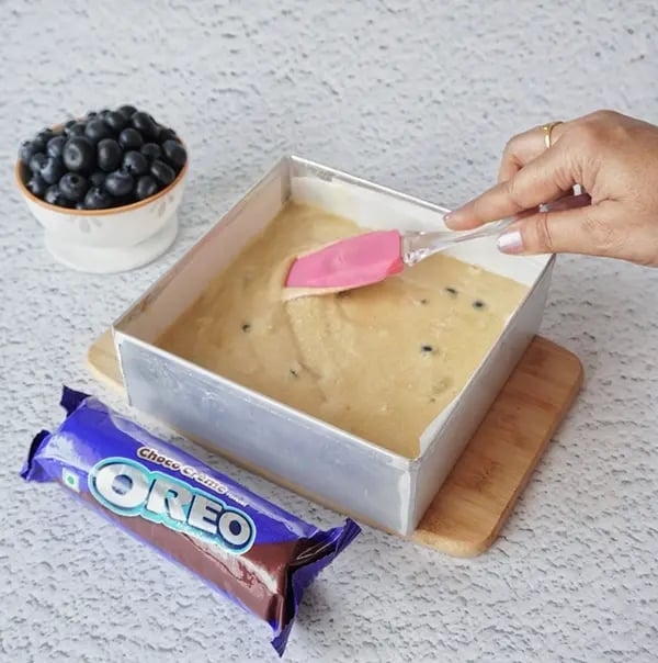 Blueberry Coffee Cake with Oreo Crumble and Almonds-Grease and line a square or round baking pan