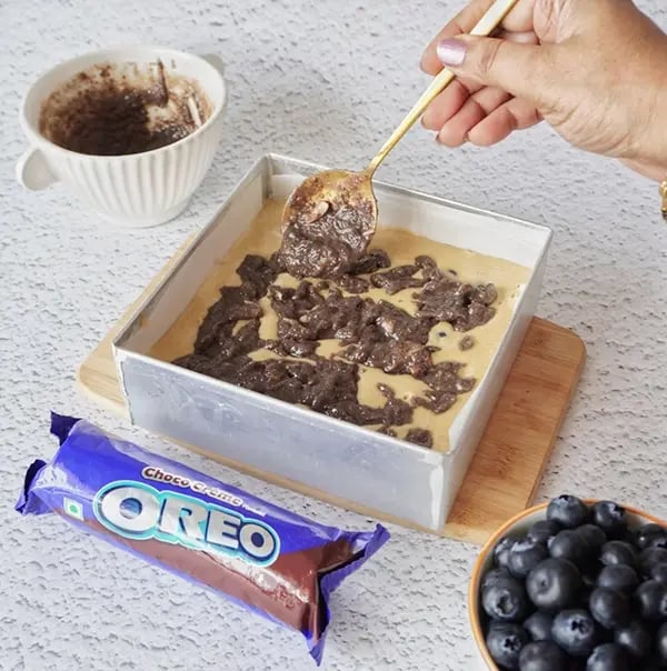 Blueberry Coffee Cake with Oreo Crumble and Almonds-Spread the Oreo-almond crumble mixture over the batter
