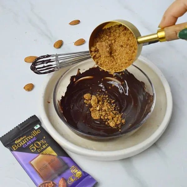 Bournville Almond Chikki Sweet - Add jaggery powder