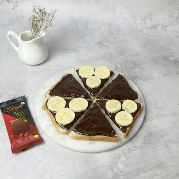 Bournville Banana Bread Pizza Dessert - Bread Slices Cut Diagonally