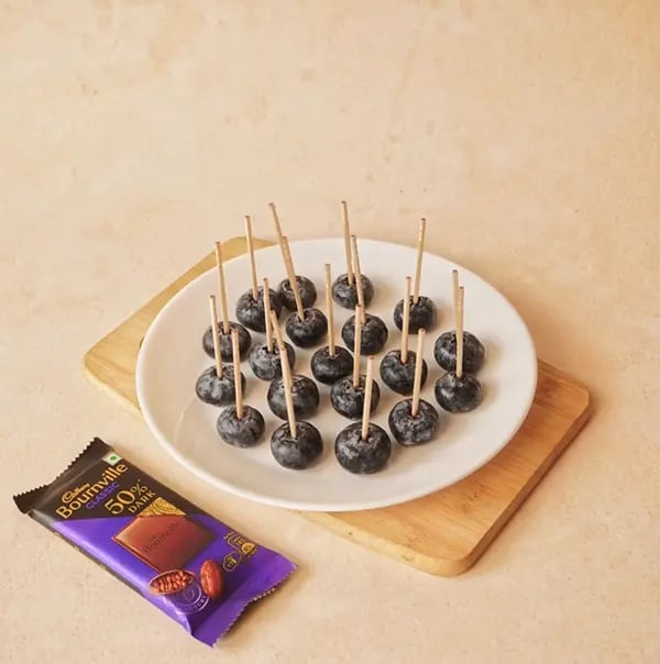 Bournville Blueberry Treats-Insert a toothpick into each blueberry
