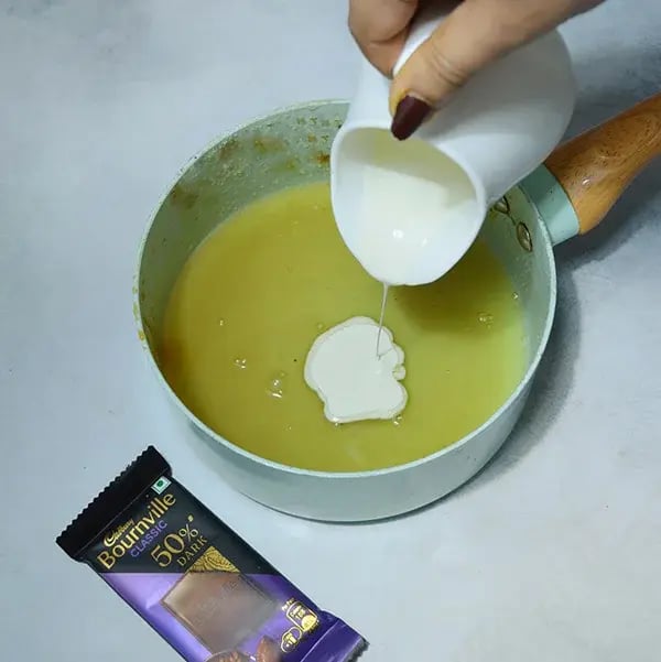 Bournville Caramel Cashew Chocolate Bar - Pour whipped cream