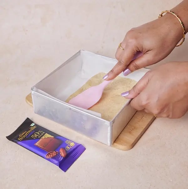 Bournville Chocolate and Coconut Candy Bar-Transfer the mixture to a baking tray