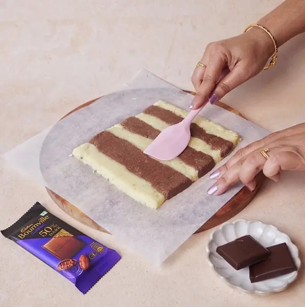 Bournville Chocolate and Khowa Barfi-On a sheet of parchment paper