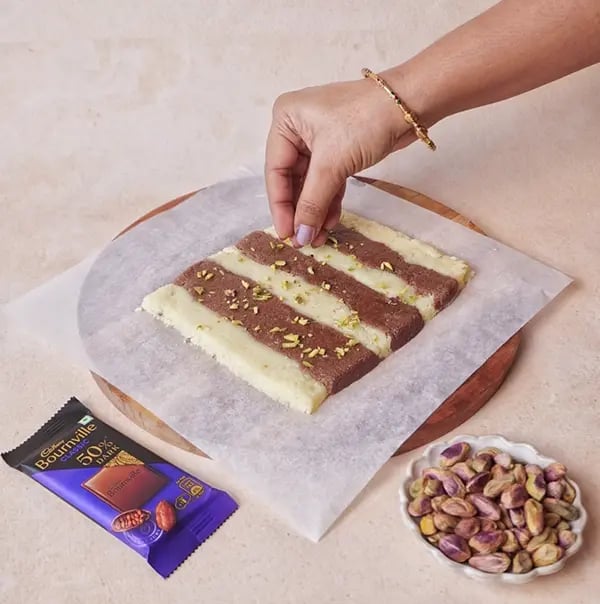 Bournville Chocolate and Khowa Barfi-Sprinkle chopped pistachios over the top