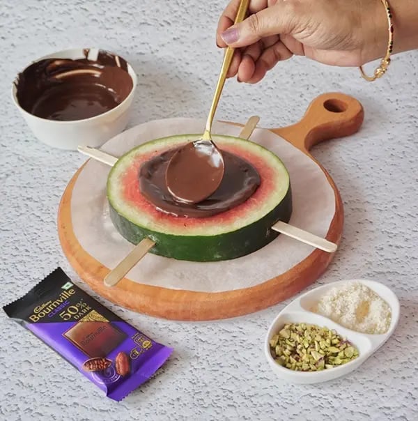 Bournville Chocolate and Watermelon Lollipops-Pour the melted chocolate onto the center