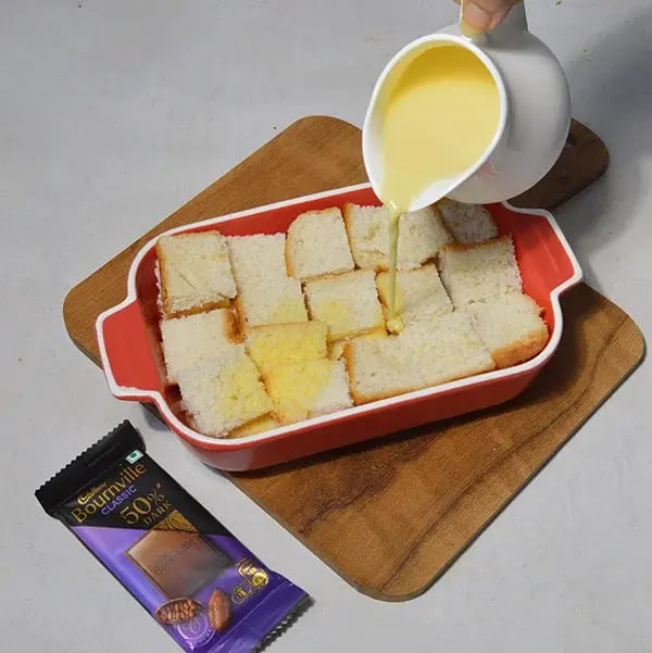 Bournville Chocolate Bread Pudding - Spread the custard milk
