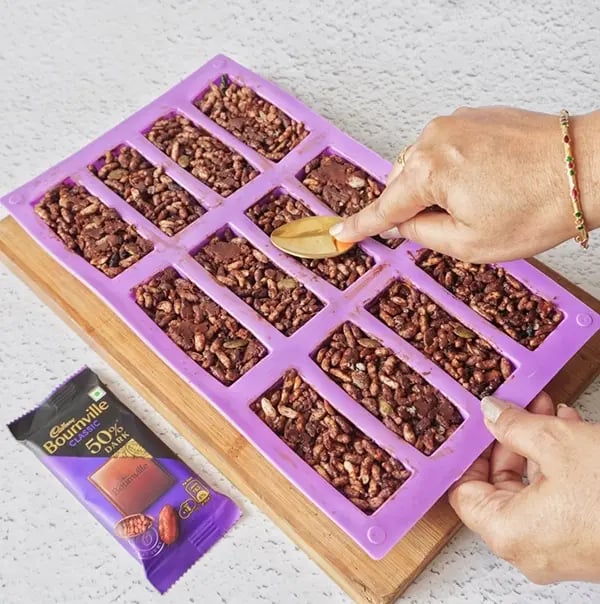Bournville Chocolate Caramel Puffed Rice Krispie - Transfer the mixture into a mould or a greased pan