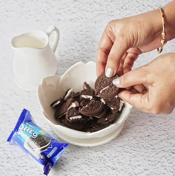 Bournville Chocolate Coated Oreo Candies - Crush the OREO cookies in a bowl