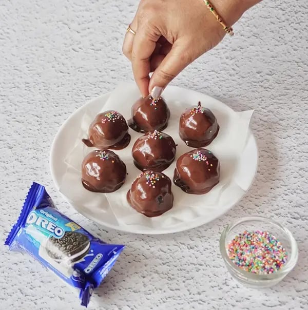 Bournville Chocolate Coated Oreo Candies - Garnish with colorful sprinkles for a festive touch
