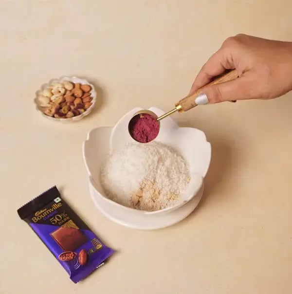 Bournville Chocolate Coated Red Velvet Giant Modak with Coconut and Nuts for Ganesh Chaturthi - Add beetroot powder directly to the mixture