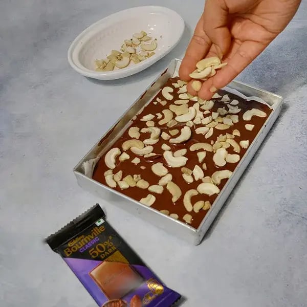 Bournville Chocolate Covered Cashew Brittle - Pour melted chocolate