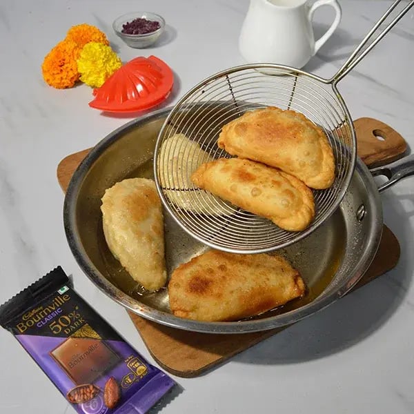 Bournville Chocolate Dipped Tutti Frutti Gujiya - Heat oil