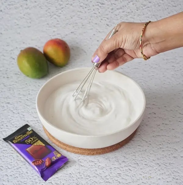 Bournville Chocolate Drizzled Mango Ice Cream-Whip the chilled cream