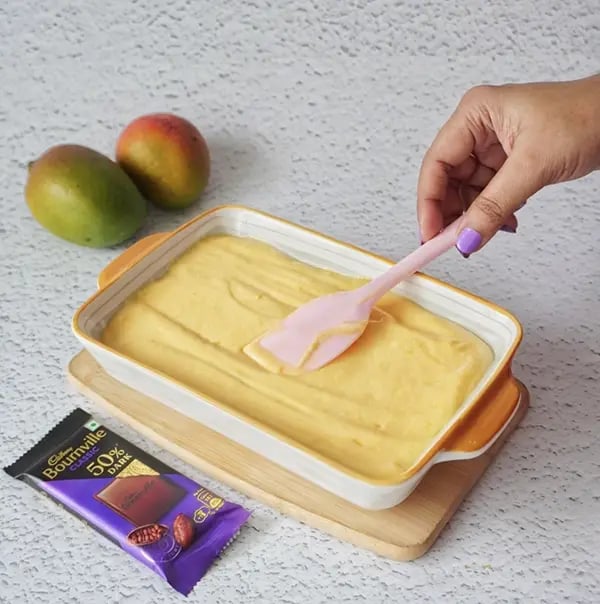 Bournville Chocolate Drizzled Mango Ice Cream-Pour the mixture into a freezer safe