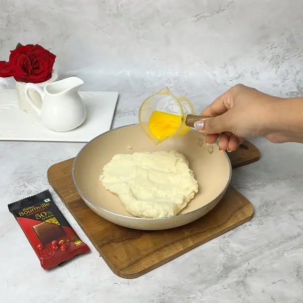 Bournville Chocolate Eclairs - Mixing Eggs Into Batter