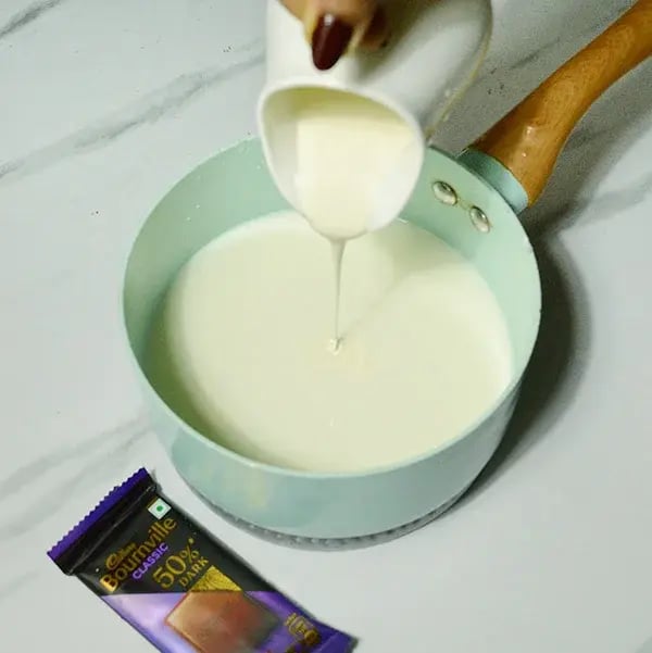 Bournville Chocolate Eggnog - Take a saucepan and add milk