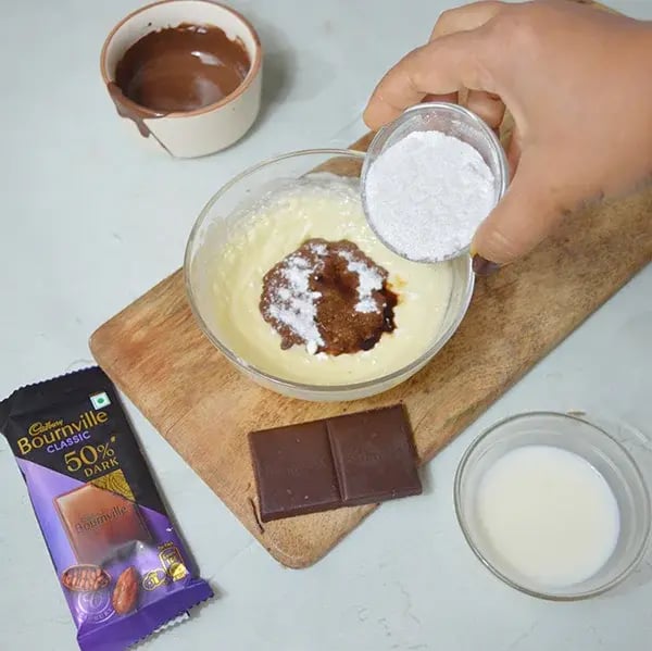 Bournville Chocolate Frosting Recipe - Adding Powdered Sugar