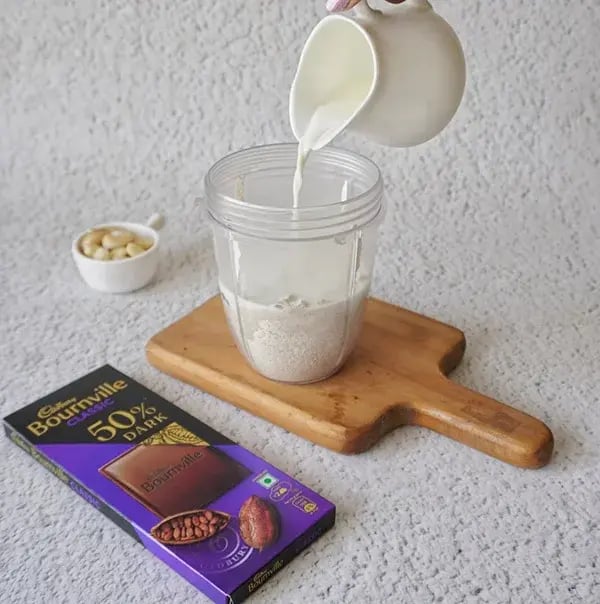 Bournville Chocolate Ice Cream with Dry Fruits - Pour milk