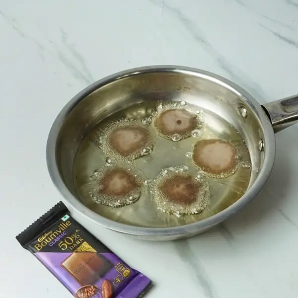 Bournville Chocolate Malpua Rabdi Bites - Ghee in a heavy bottom pan