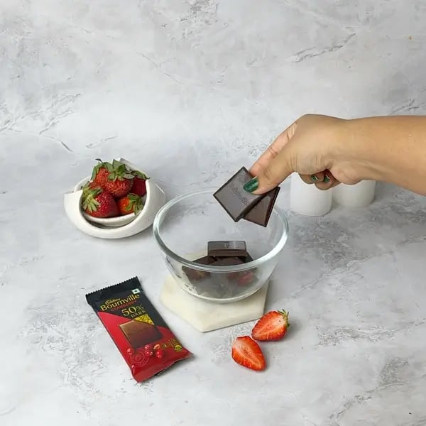 Bournville Chocolate No-Bake Strawberry Cheesecake - Melted Chocolate In Bowl