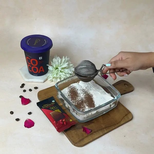 Bournville Cocoa Tiramisu Icebox Cake - Dusting Cocoa Powder