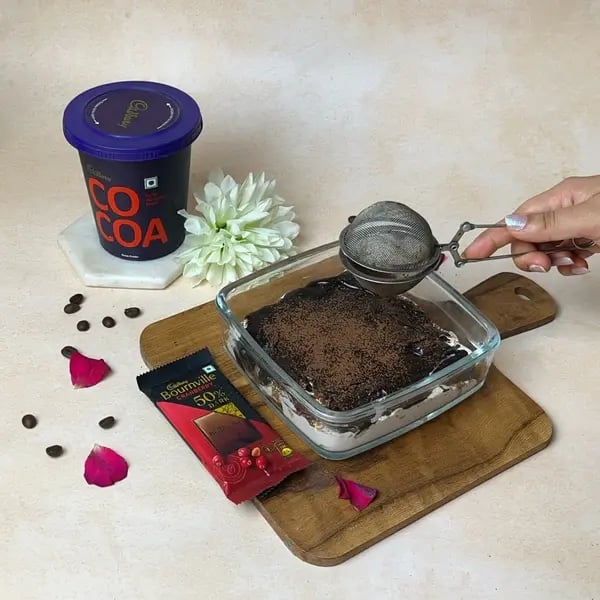Bournville Cocoa Tiramisu Icebox Cake - Dusting Cocoa Powder