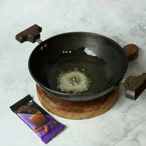 Bournville Coconut Sel Roti-Heat oil or ghee in a pan