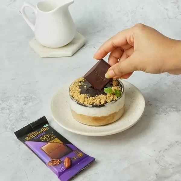 Bournville Covered No-Bake Biscoff Cheesecake-Sprinkle some crushed Biscoff crumbs