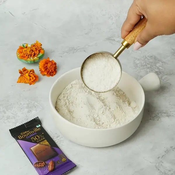 Bournville Dipped Thekua for Chhath Pooja-Next add coconut with the dry ingredients