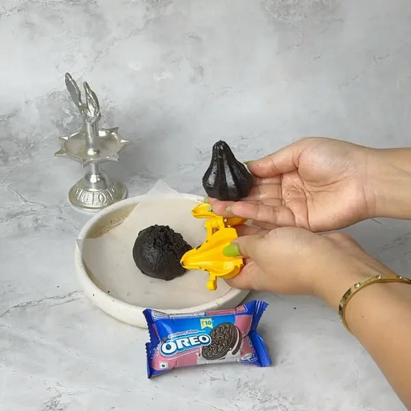 Bournville Dipped Oreo Modak - Releasing Modak From Mold