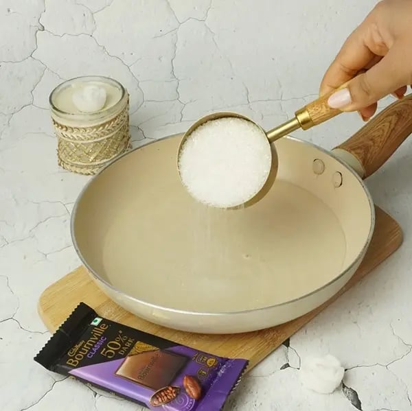 Bournville Kesar Kaju Katli - Stir gently and dissolve the sugar