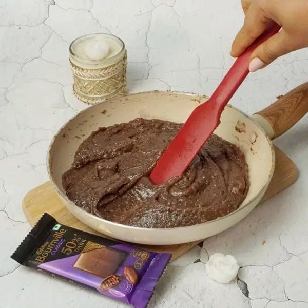 Bournville Kesar Kaju Katli - Continue to cook the mixture