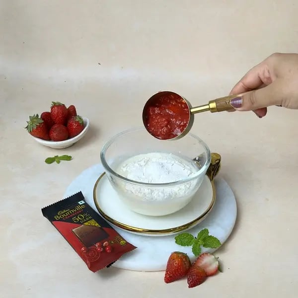 Bournville Mini Chocolate Strawberry Bundt Cake - Mixing Strawberry Puree