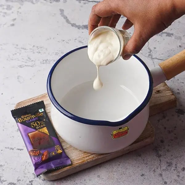 Bournville Mint Truffle - Taking fresh cream in a saucepan