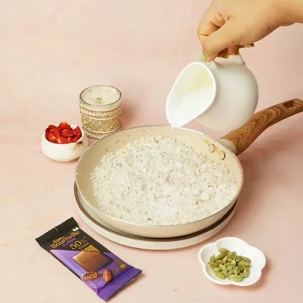 Bournville Narkel Naru for Durga Puja-pour the milk into the same pan