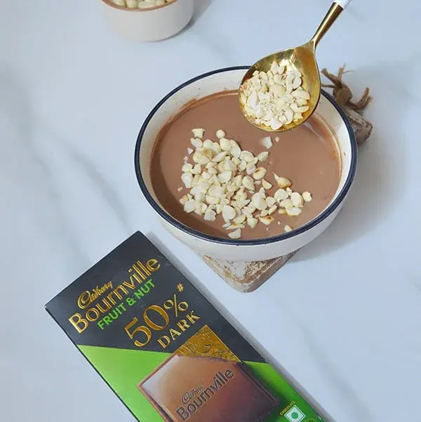 Bournville Peanut Bites - Add chopped peanuts in melted chocolate