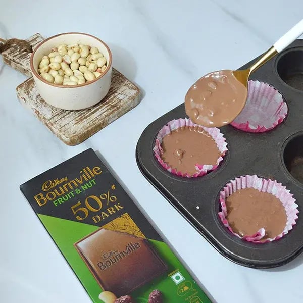 Bournville Peanut Bites - Pour the mixer in muffin tin