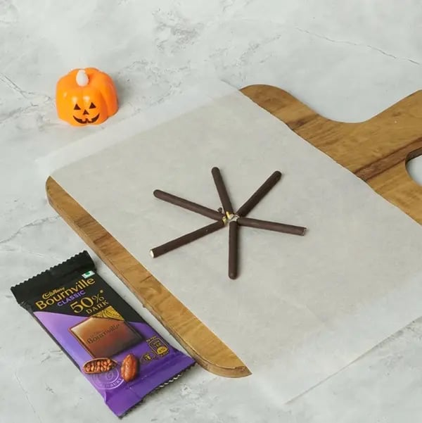 Bournville Pocky Web Spider Bites for Halloween-Lay them out in star shape