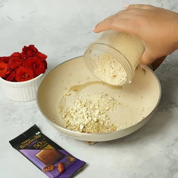 Bournville Poha Peanut Laddu for Chhath Pooja-Heat ghee and fry chopped cashews