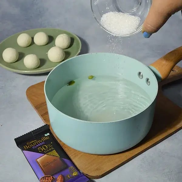 Bournville Rose Gulab Jamun - Boil water &amp; sugar