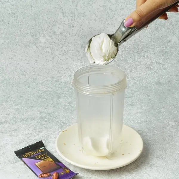 Bournville Soan Papdi Pistachio Milkshake-Take a blending jar and add a generous scoop
