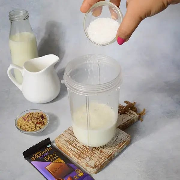 Bournville Thandai with Walnuts - Add milk and suga inr blending jar
