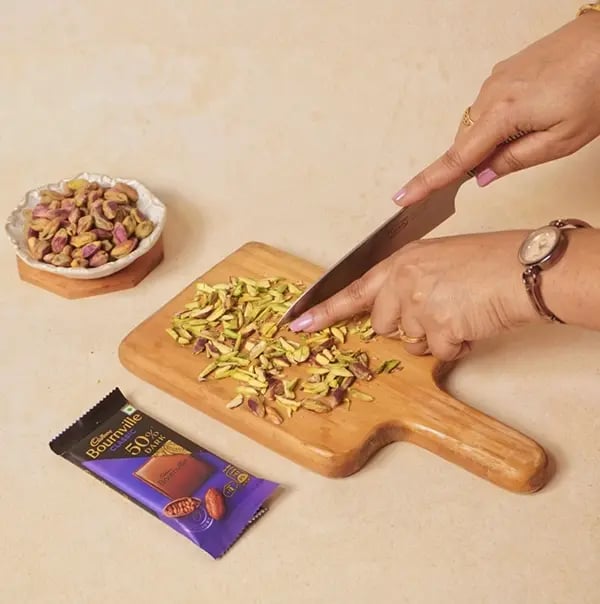 Cadbury Bournville and Pistachio Discs-Roughly chop the roasted pistachios