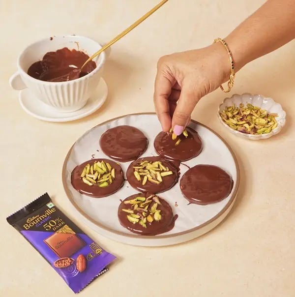 Cadbury Bournville and Pistachio Discs-While the chocolate is still wet