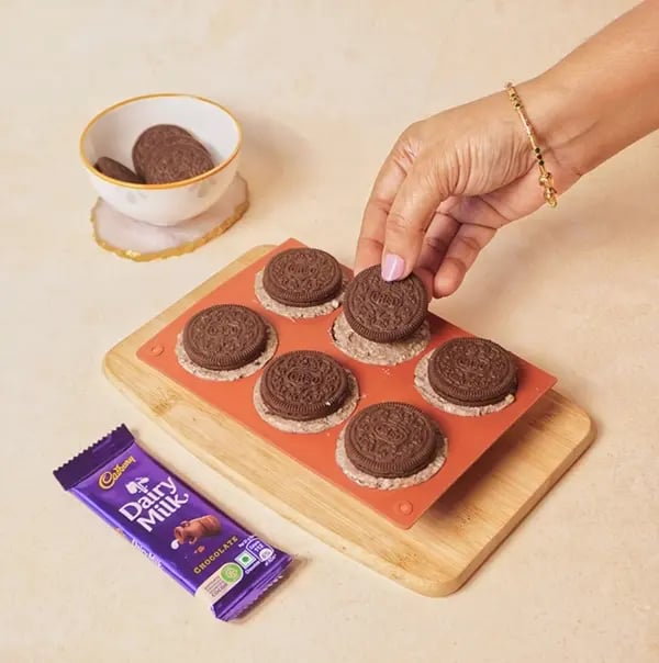 Cadbury Dairy Milk Chocolate Yogurt Bombs-Gently press an Oreo cookie