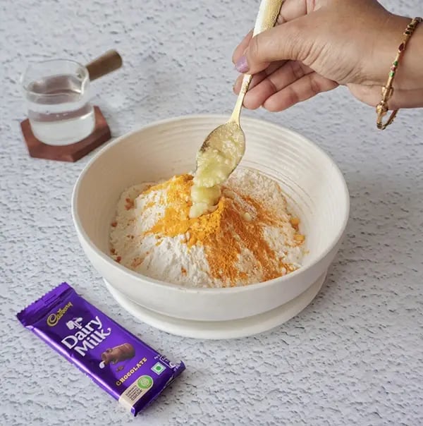 Cadbury Dairy Milk Puran Poli with Cashews and Almonds - Add wheat flour, maida, turmeric, salt, and ghee