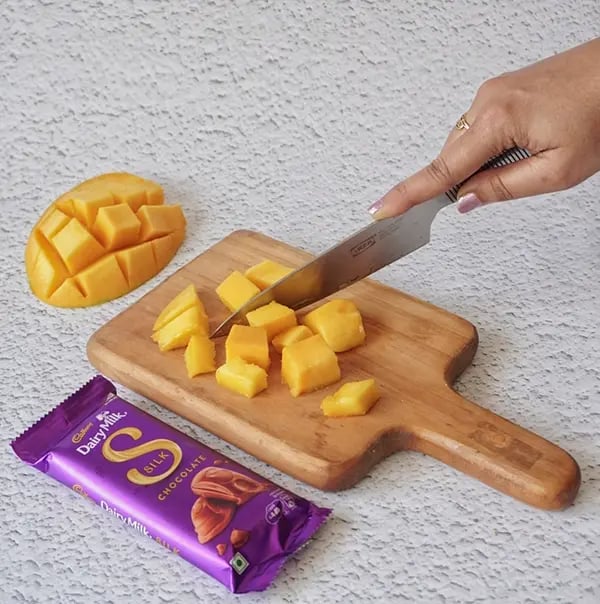 Cadbury Dairy Milk Silk and Mango Layered Kulfi with Cashew Nuts - For making the mango layer Chop the mangoes